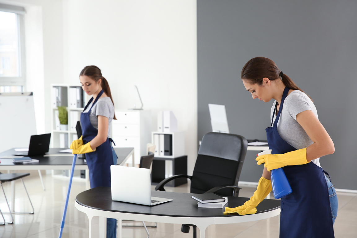 Team of Janitors Cleaning Office