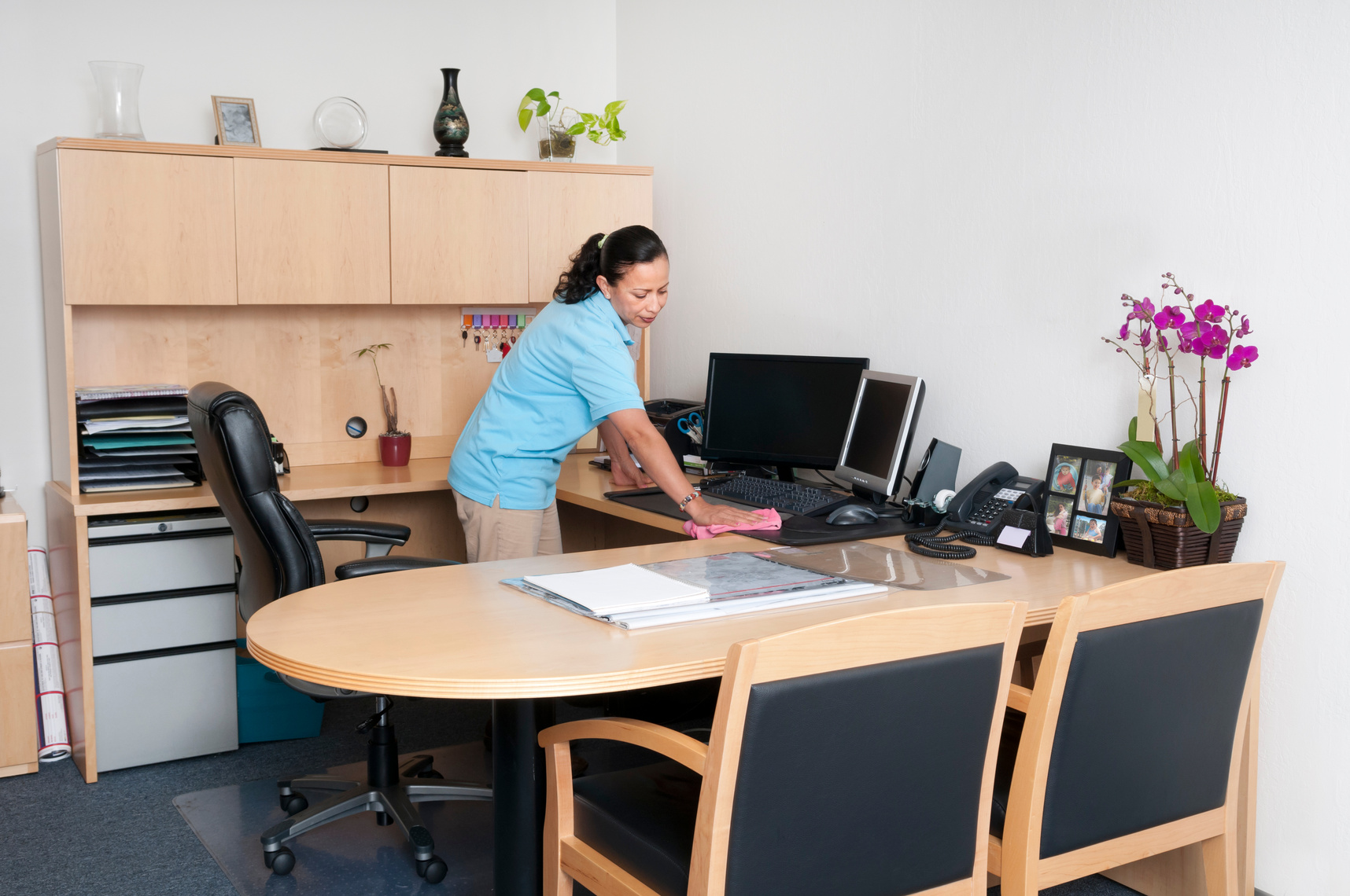 Professional Janitorial Service - Woman Cleaning an Office